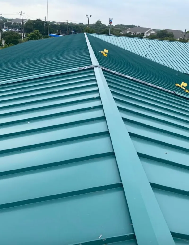 Green commercial metal roof ridge and valley for Metal Roof Repair in New Baltimore